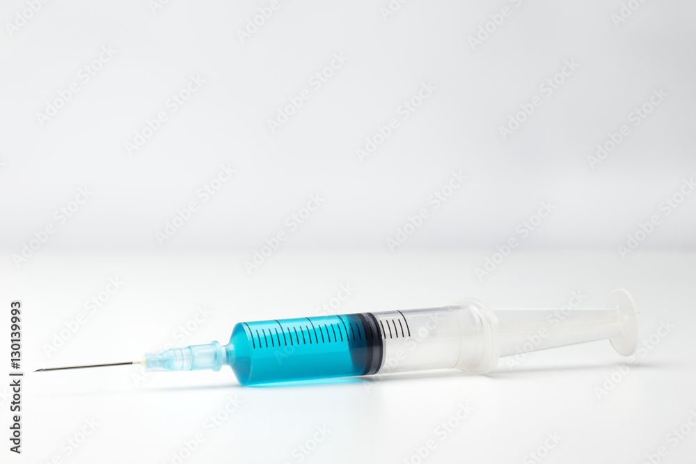 single syringe in white single syringe in white