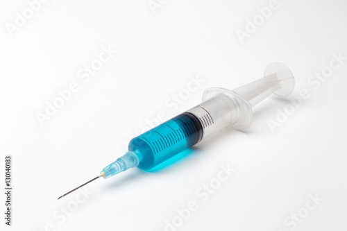 single syringe in white