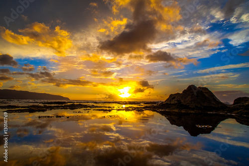 Beautiful Hawaiian sunset reflected in tide pool on the North Shore of Oahu © shanemyersphoto