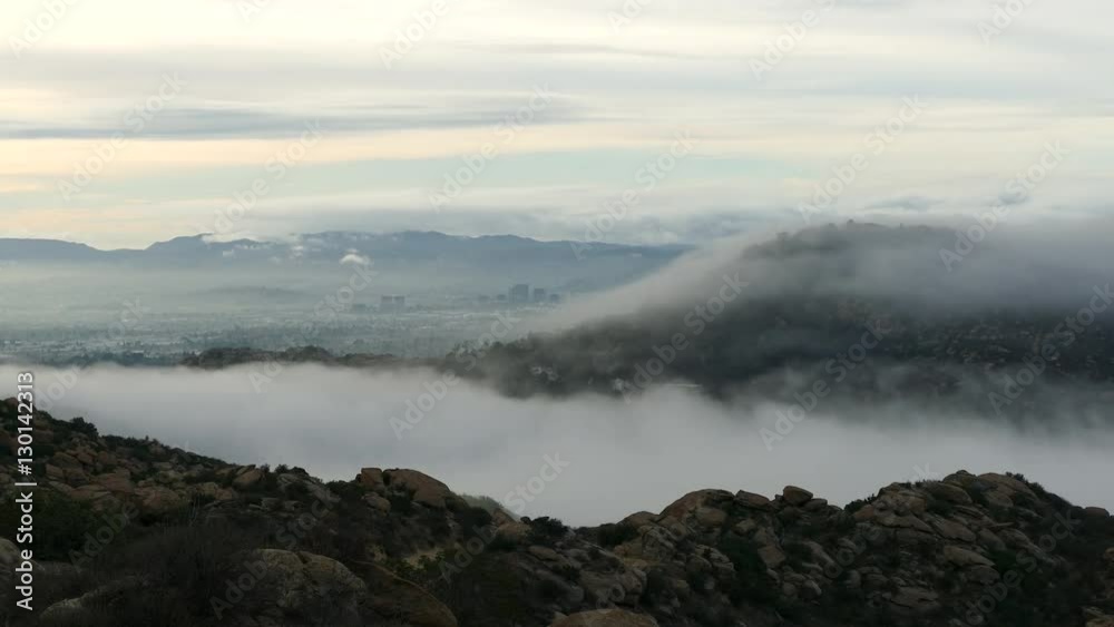 Time lapse of fog rolling over the Santa Susana Mountains into Woodland Hills in Los Angeles, California. Time lapse of fog rolling over the Santa Susana Mountains into Woodland Hills in Los Angeles, California.