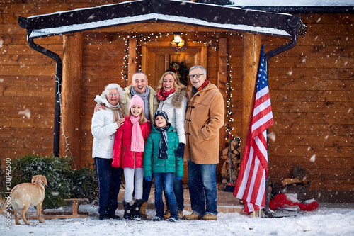 Portrait of happy family outdoor on xmas. © luckybusiness