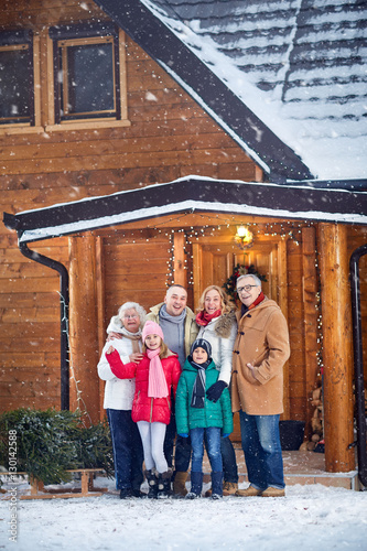 Portrait of smiling family outdoor on xmas. © luckybusiness