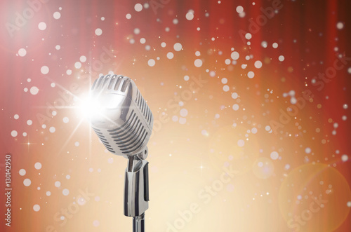 Retro microphone over the Abstract photo of chrismas and blurred