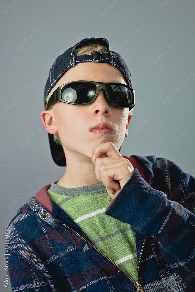 Young Blond Boy With Sunglasses And Cap Looking Cool Stock Photo Adobe Stock