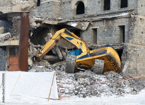 digger brought down building