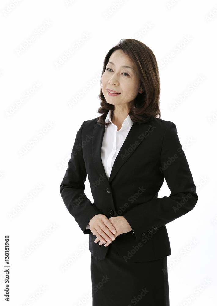 Concierge standing with her hands clasped Concierge standing with her hands clasped
