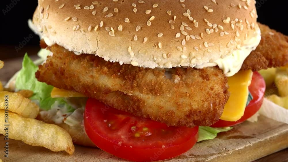 Fresh made Fish Burger (rotating) as seamless loopable 4K UHD footage) Fresh made Fish Burger (rotating) as seamless loopable 4K UHD footage)