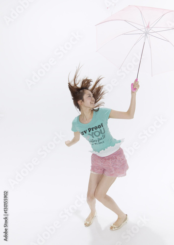 Young woman holding umbrella