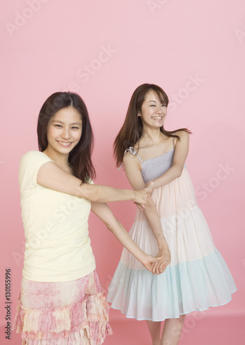 Young women holding hands