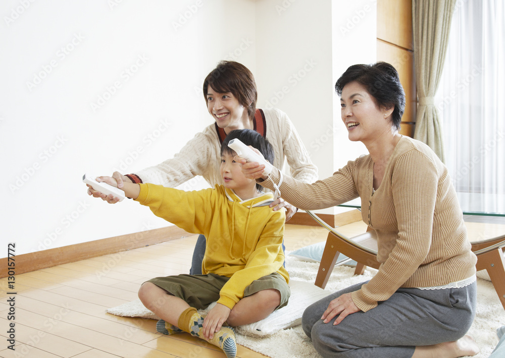 Three-generation family playing video games