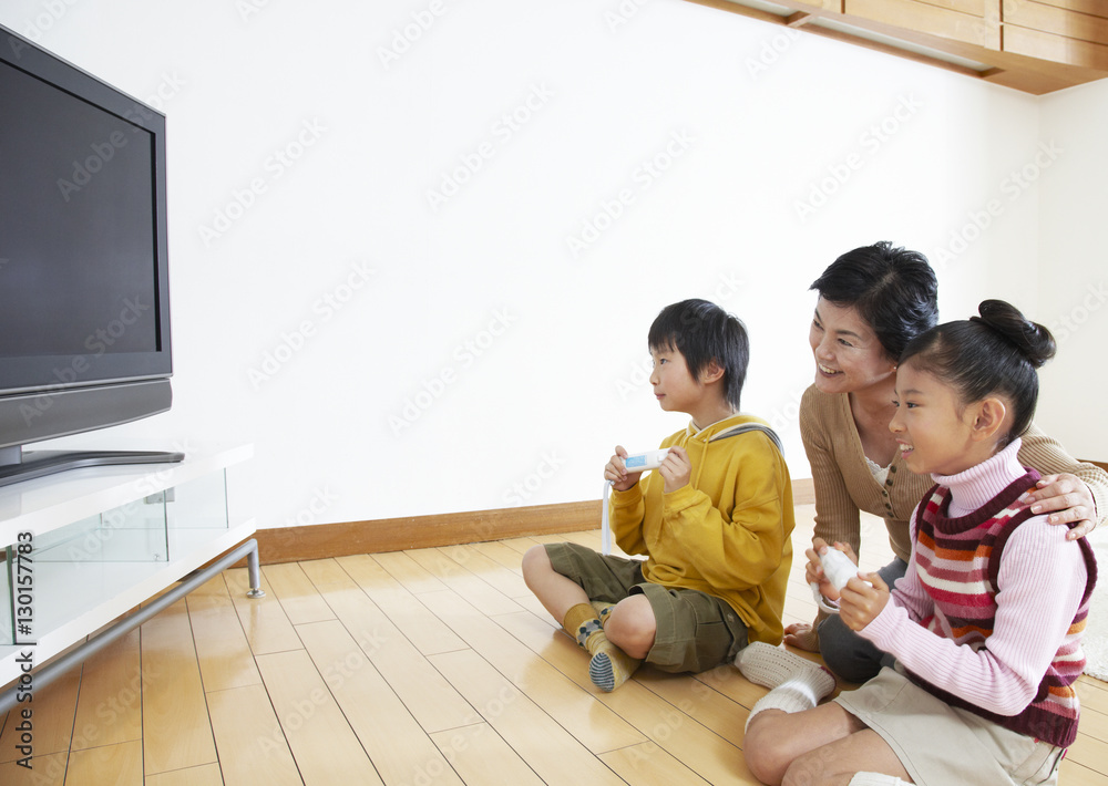 Grandmother and grandkids playing video games Grandmother and grandkids playing video games