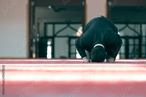 Young beautiful Muslim Man Praying In Mosque