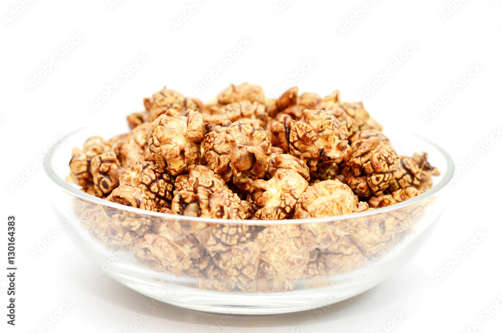 Chocolate Popcorn in a glass Bowl on white background for packag Chocolate Popcorn in a glass Bowl on white background for packag