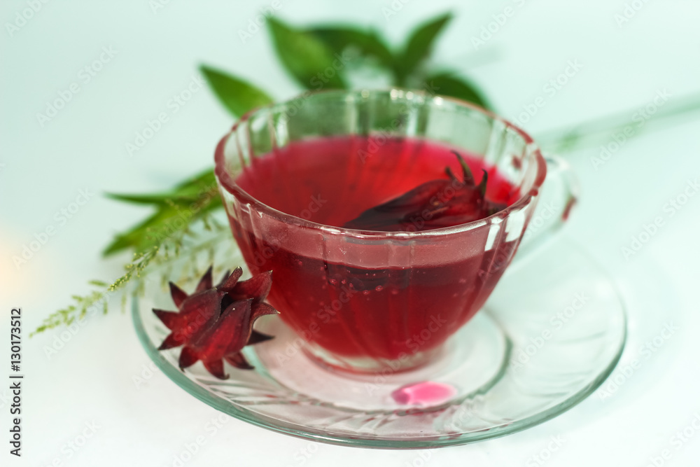 Glass of cold roselle juice - healthy food against wood Glass of cold roselle juice - healthy food against wood