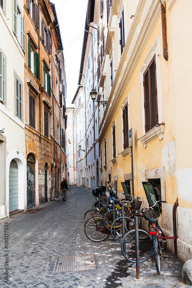 narrow street with bicycles in Rome city
