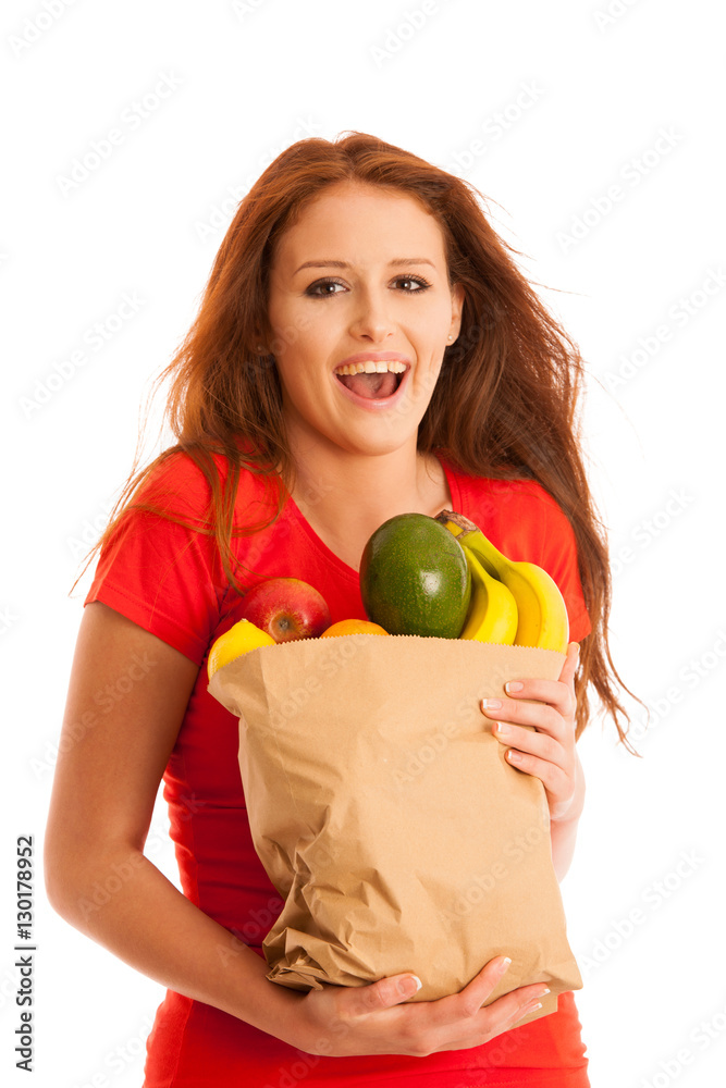 woman carrying a bag full of various fruits isolated over white woman carrying a bag full of various fruits isolated over white