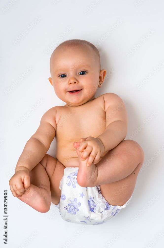 Adorable baby girl lying on back - isolated on white Adorable baby girl lying on back - isolated on white