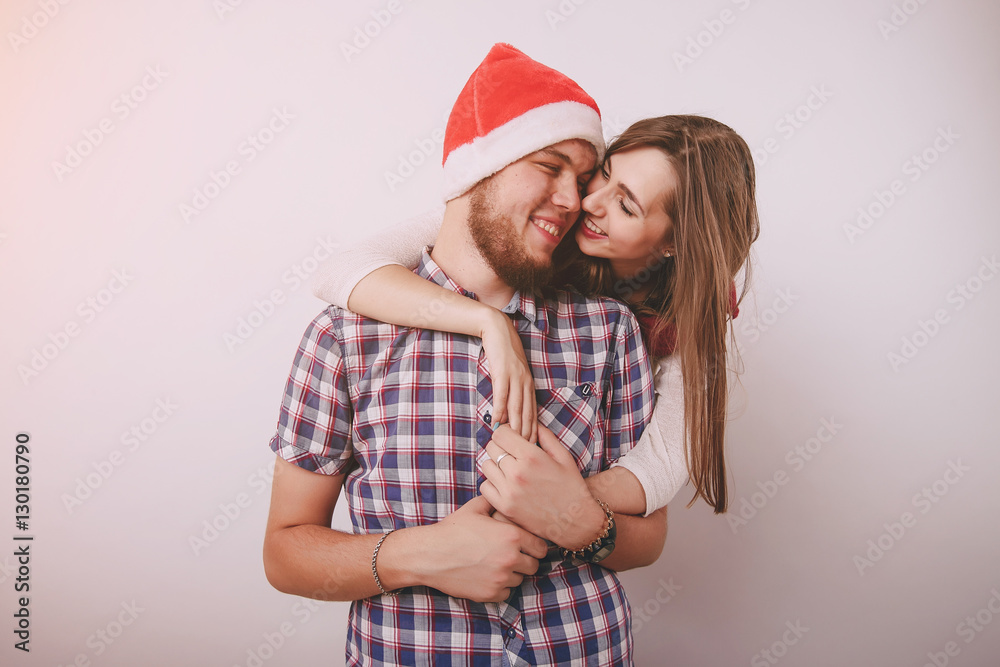 Fototapeta premium loving couple decorating Christmas tree