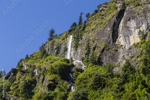 Majestic mountain and waterfall in Himalayas mountains in Nepal