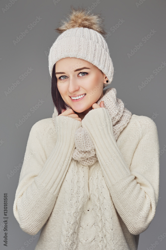 Positive female dressed in warm pullover.