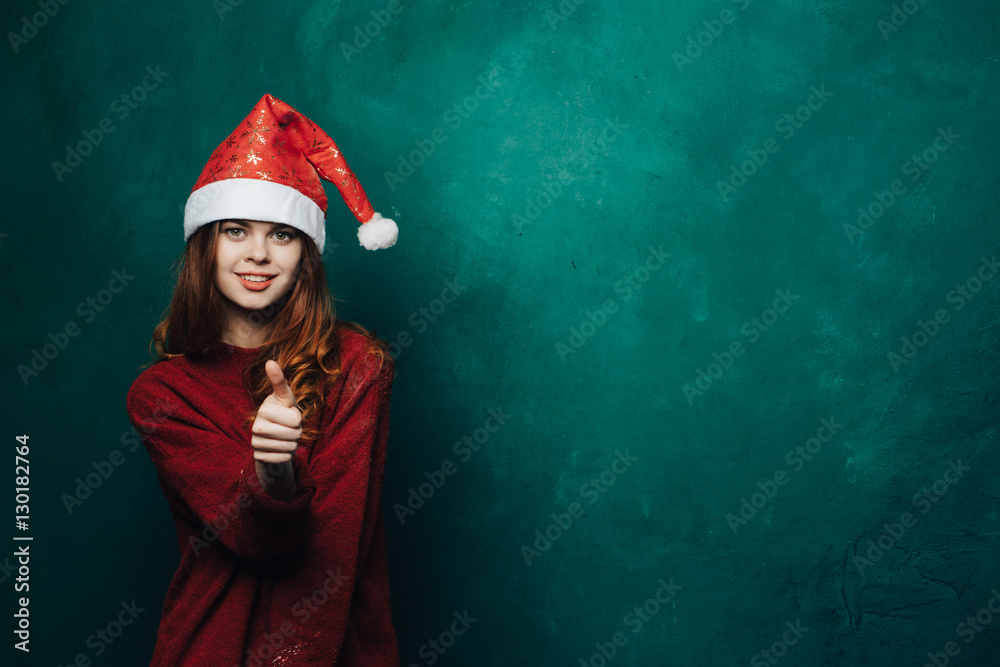 Woman in New Year's cap on a colored background
Woman in New Year's cap on a colored background