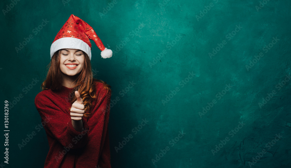 Woman in New Year's cap on a colored background
