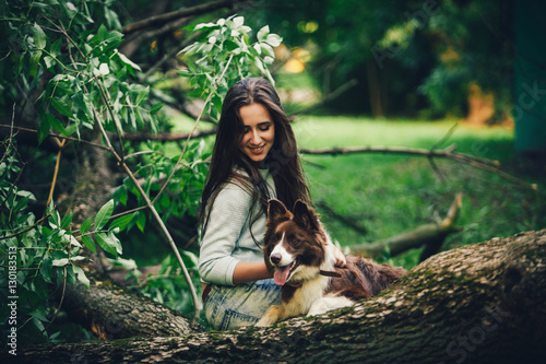 Woman playing with dog