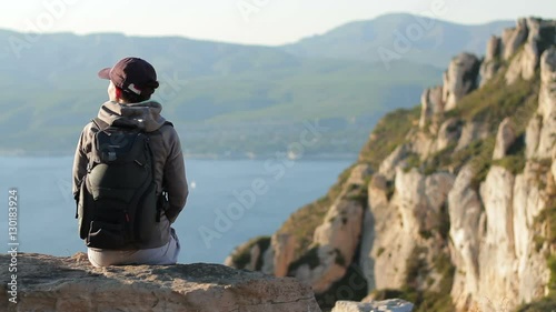 Young female tourist enjoying beautiful view in the mountains, Calanques, France
