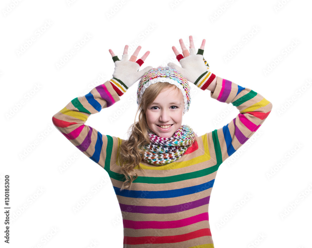Cute cheerful teenage girl wearing colorful striped sweater, scarf, gloves and hat isolated on white background. Winter clothes. Composite image. Cute cheerful teenage girl wearing colorful striped sweater, scarf, gloves and hat isolated on white background. Winter clothes. Composite image.