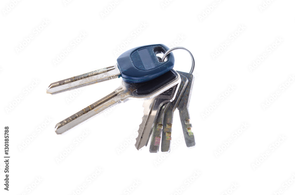 bunch of keys from a door on a white background close up bunch of keys from a door on a white background close up