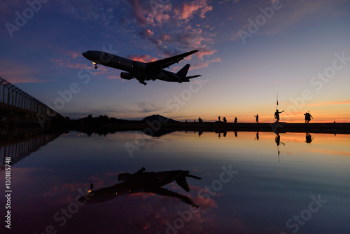 airplane Landing at Phuket International airport in twilight tim