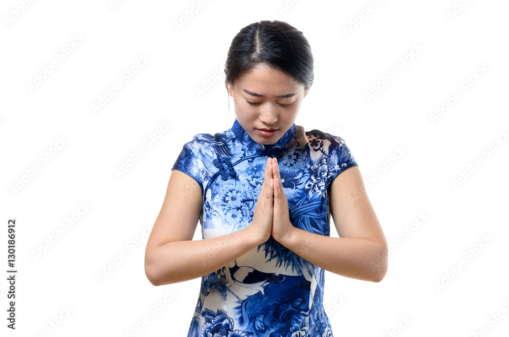 Young Chinese woman bowing her head Young Chinese woman bowing her head
