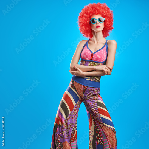Fashion Model woman, Stylish hairstyle. Fashion Makeup. Cheeky Sexy Model girl, Stylish summer Hipster Outfit. Fashion pose. Trendy Glamour Sunglasses. Playful Afro hairstyle. Party Disco Creative