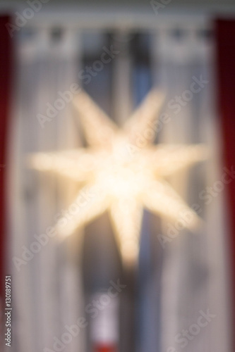 Blurred holiday background with star-shaped highlights