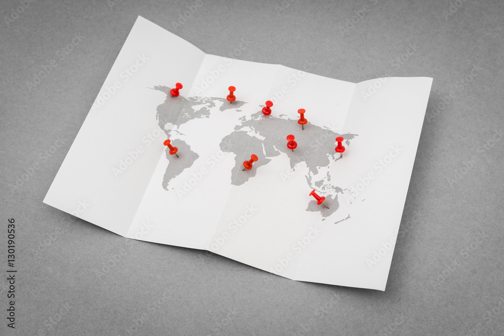 Obraz premium Paper folded world map with red Pin Pointer .