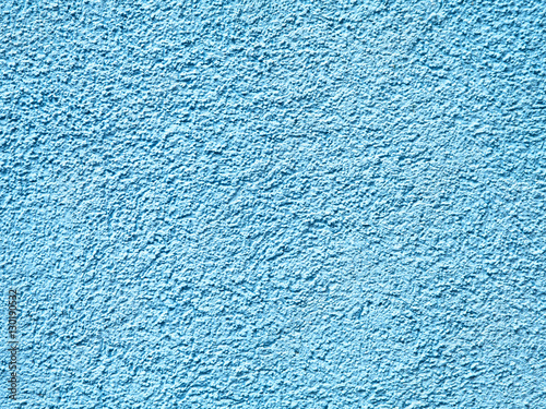 Old peeling paint on old blue concrete wall background