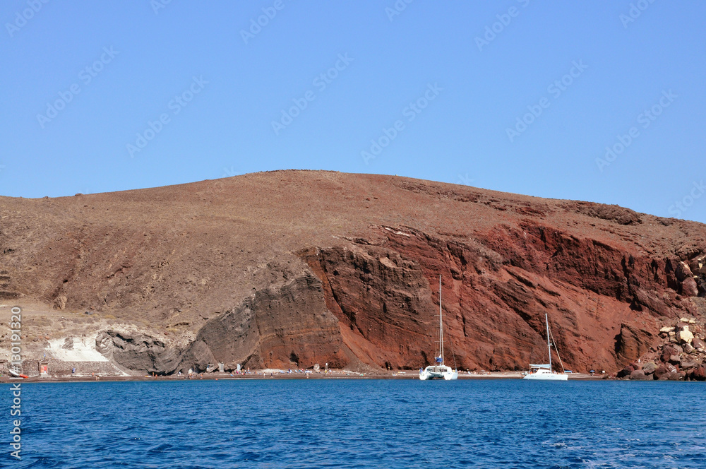 white yachts and the famous Red beach in Santorini island, Greece.