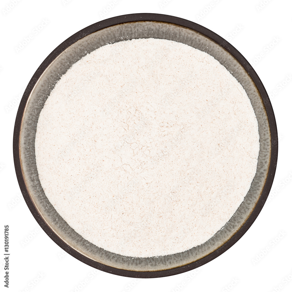 Organic locust bean gum powder in ceramic bowl isolated on white