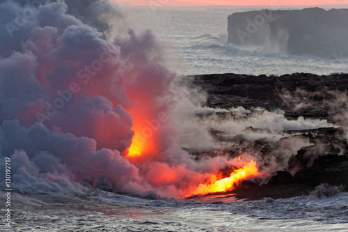Lava flowing into ocean - Kilauea Volcano, Hawaii photo