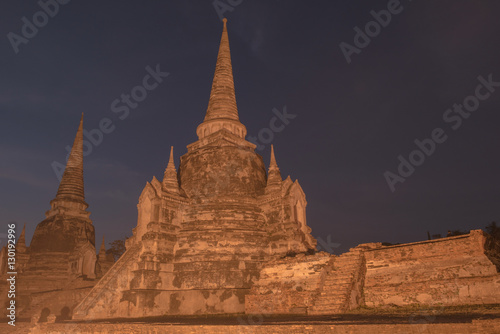 Ancient ruins of the temple Wat Phra Sri Sanphet national historic site with lights show at twilight time in Ayutthaya  Thailand.