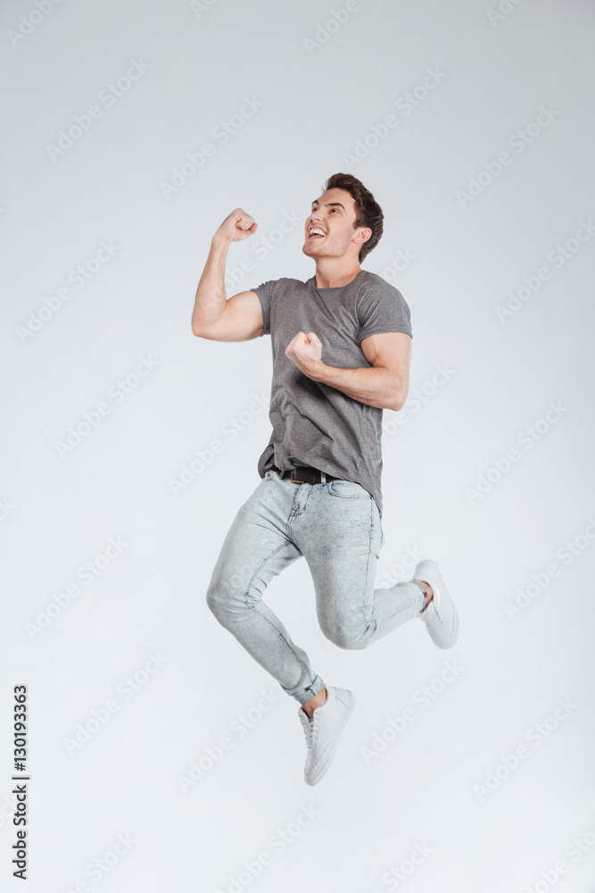 Full length portrait of a happy man celebrating his success Full length portrait of a happy man celebrating his success