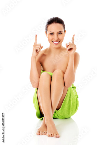 Young beautiful woman after bath full portrait isolated over white.