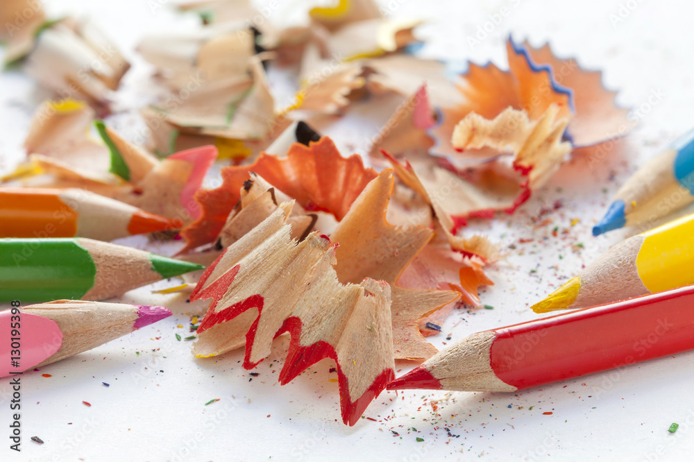 Sharpened colorful pencils and wood shavings Sharpened colorful pencils and wood shavings