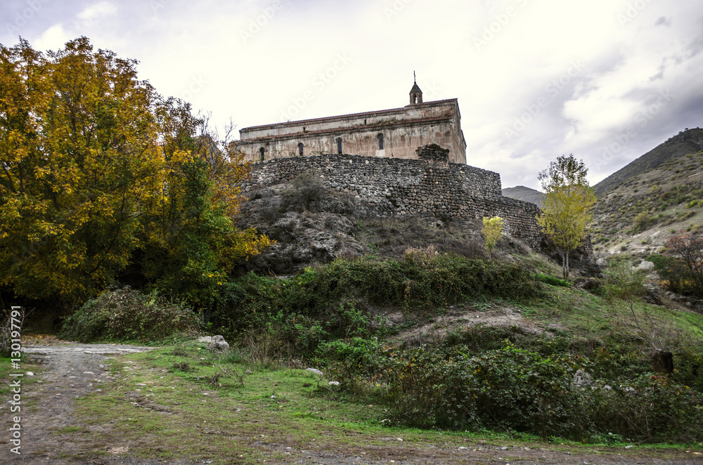 View of the medieval monastery Tsitsernavank in the autumn overcast day

