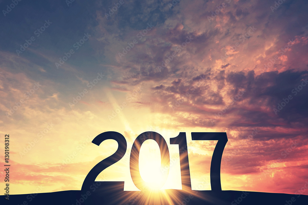2017 new year silhouette against bright sunset or sunrise - obrazy, fototapety, plakaty 