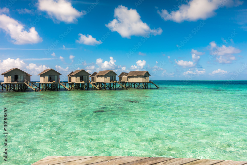 Beautiful tropical Maldives resort hotel with beach and blue wat
