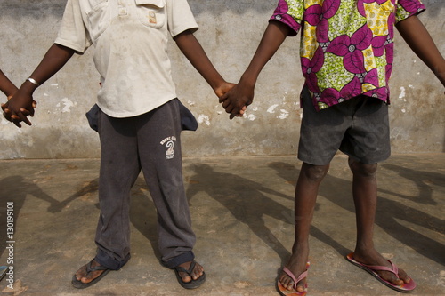 African schoolchildren holding hands, Lome, Togo, West Africa