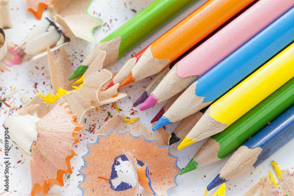 Sharpened colorful pencils and wood shavings Sharpened colorful pencils and wood shavings