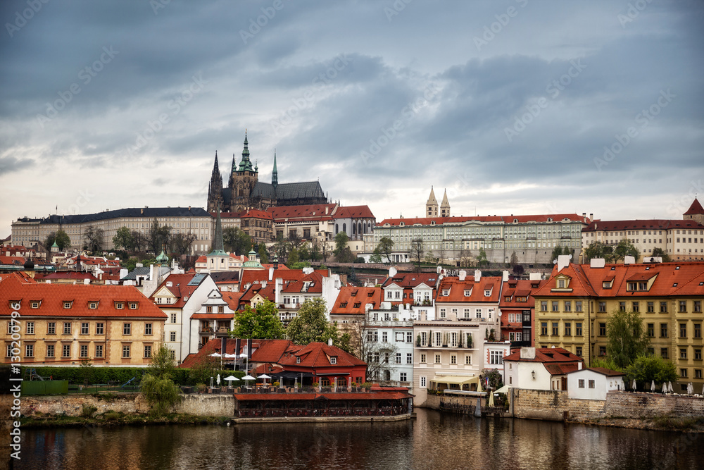 Colorful morning view of Charles Bridge, Prague Castle and St. Vitus cathedral on Vltava river. Sunny spring scene in Prague. Czech Republic - Prague old town view