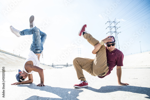 Breakdancers perfrming tricks photo